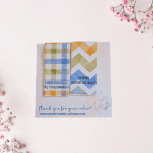 Two kids magnetic bookmarks, one blue gingham reading Little Reader Big Imagination and one green chevron reading Read On Adventure Awaits