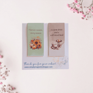 Story Season magnetic bookmark duo, a sunflower and pumpkin bouquet and a mug of cocoa, on a thank-you card